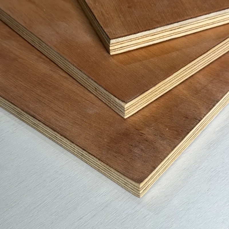 Stacked sheets of brown plywood showing the layered edge