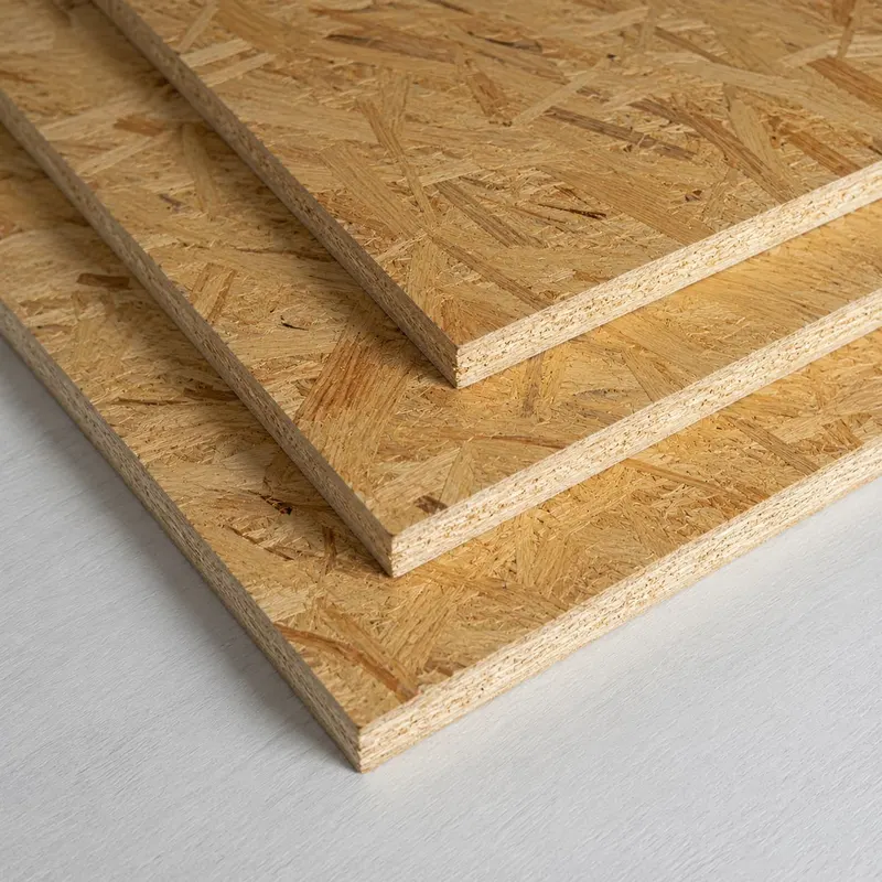 Stacked OSB boards with their characteristic wood strand surface