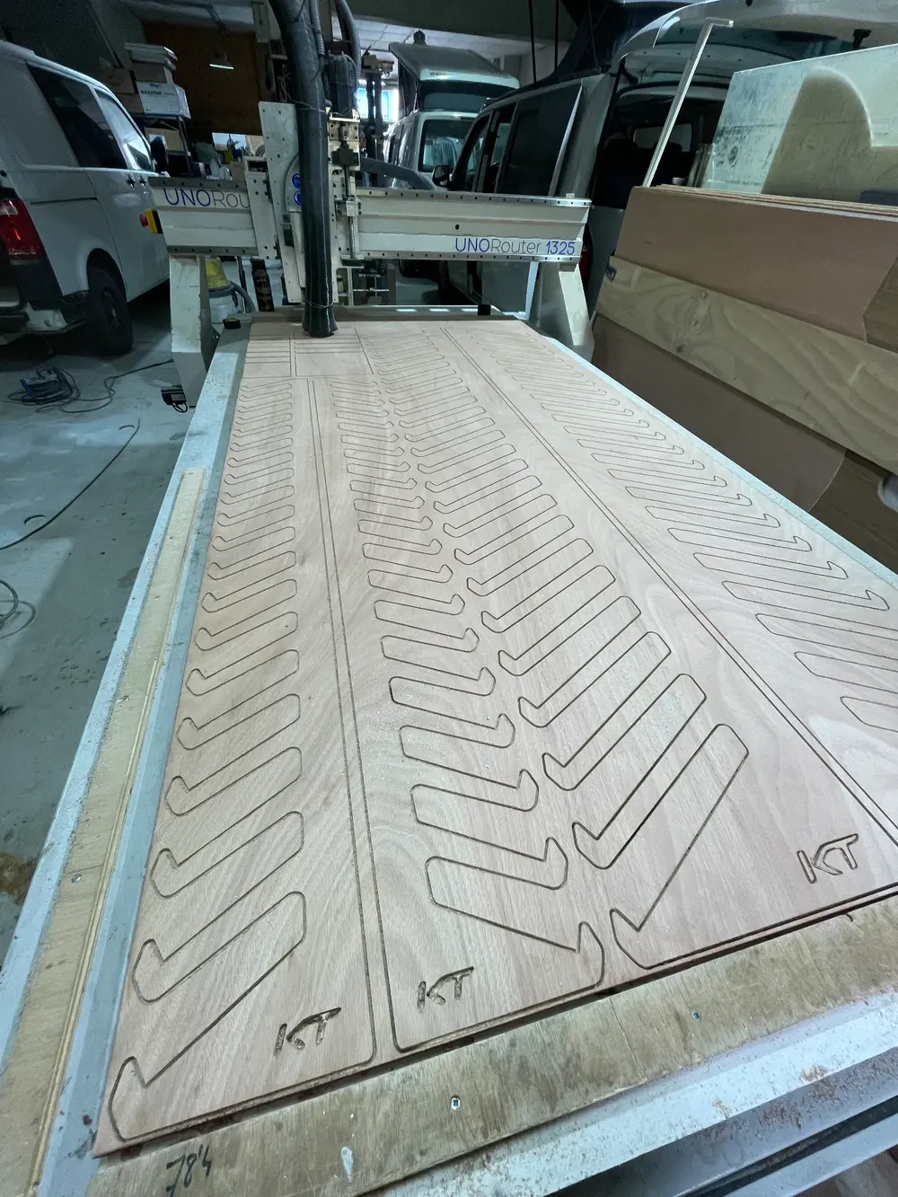 Identical CNC cut plywood parts nested on a sheet during a production run in Tarifa