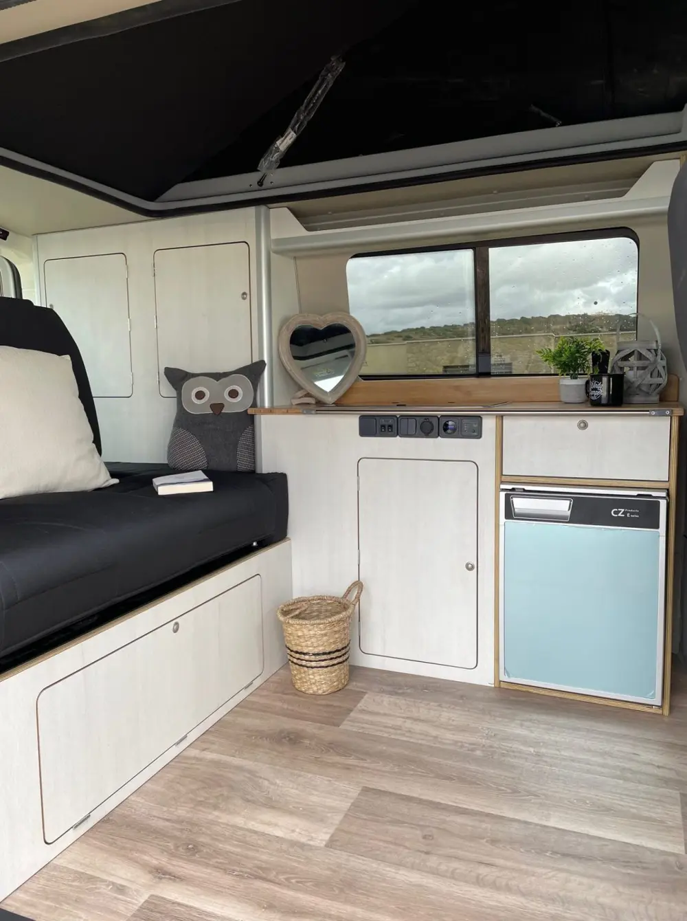 Finished campervan interior with CNC cut cabinet fronts and panels