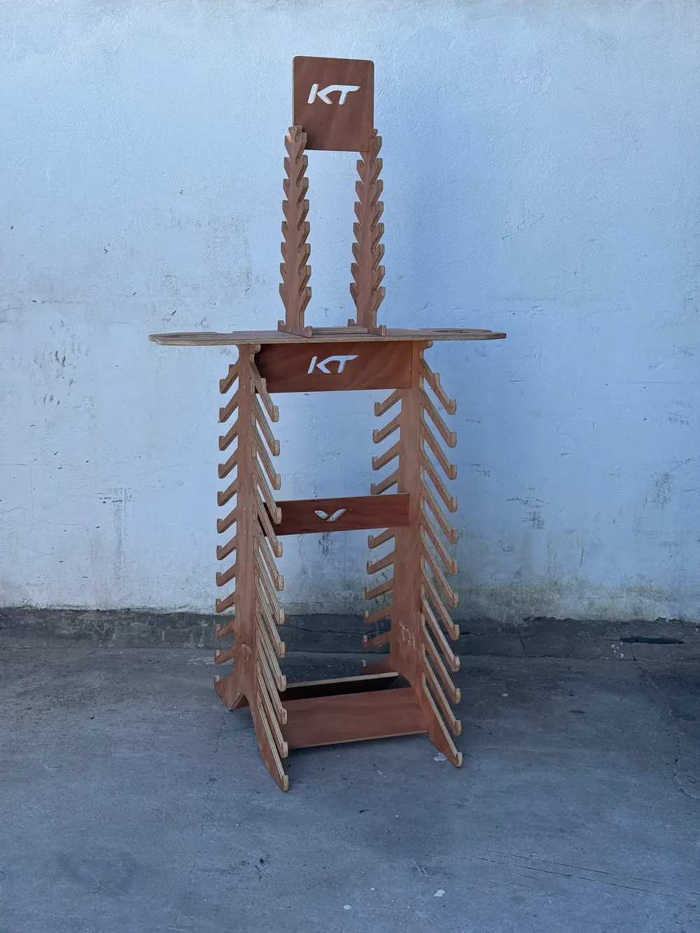 CNC cut plywood display stand with routed logo cut-outs made in Tarifa